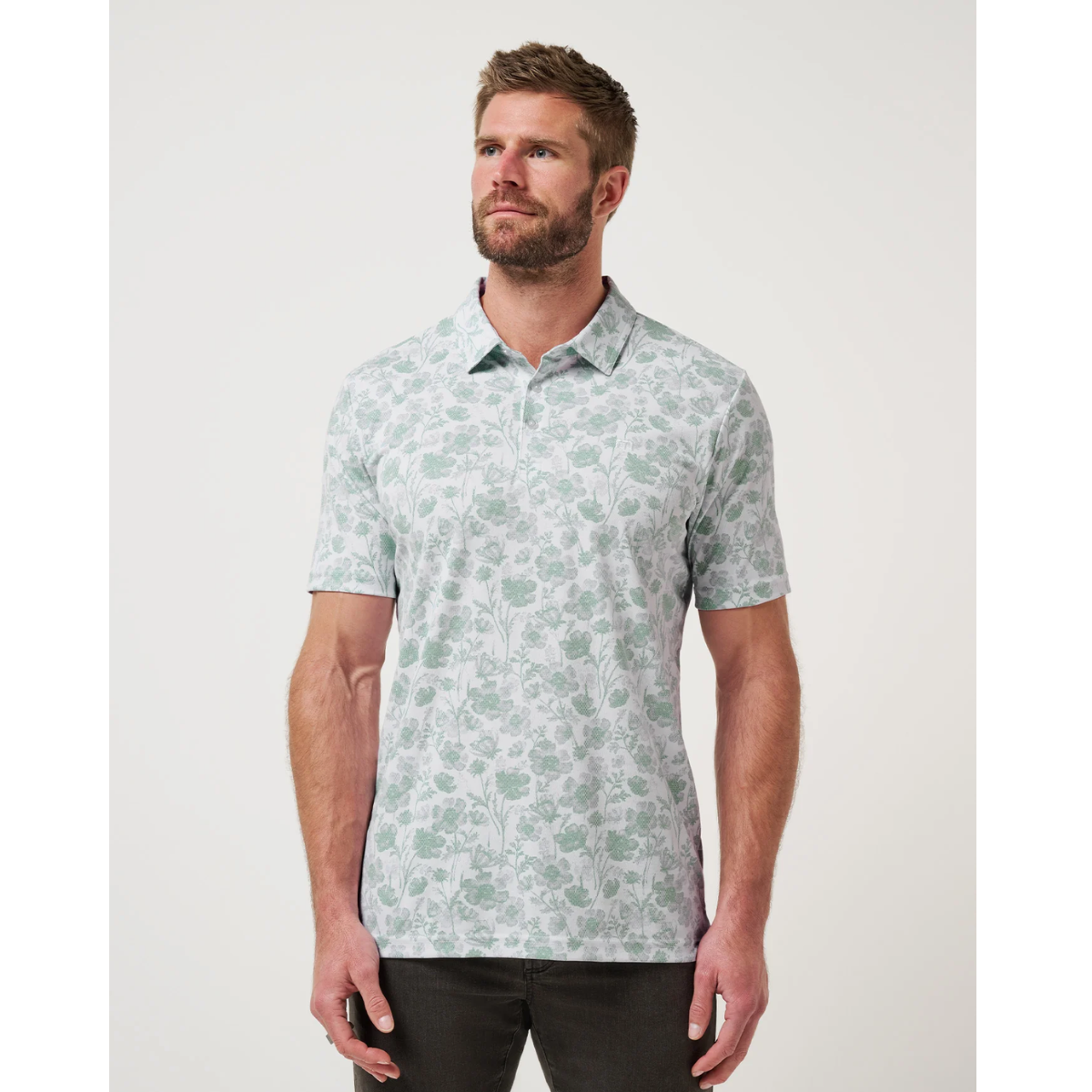 Travis Mathew Been Abroad men's golf polo front view in white with floral jacquard