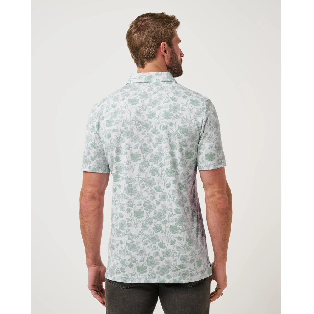 Travis Mathew Been Abroad white golf polo floral jacquard detail view