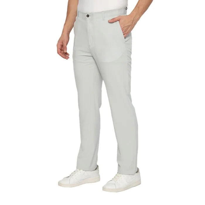 Light gray pants worn by a person on a white background